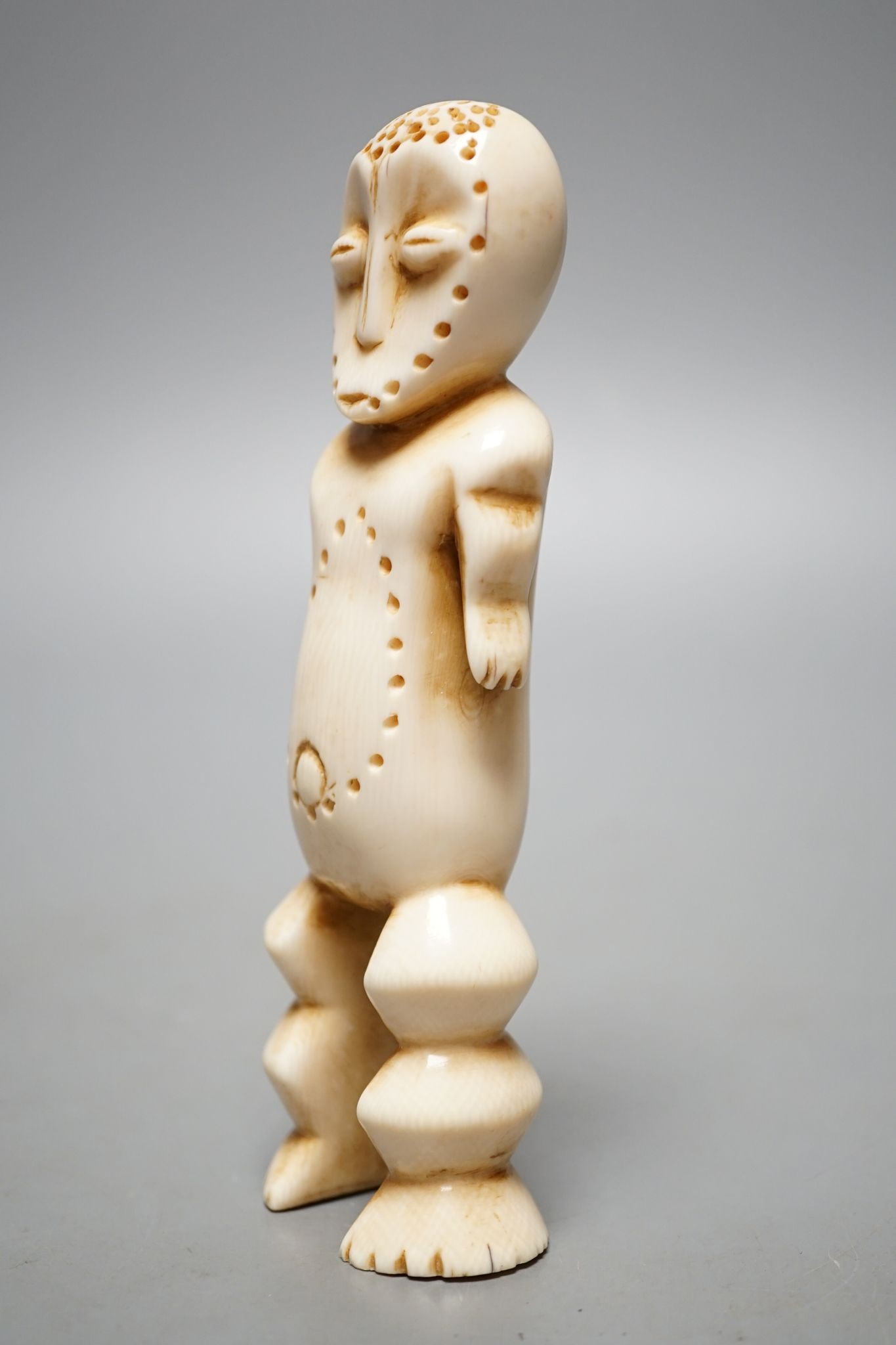 A Lega ivory figure, 15 cms high.
